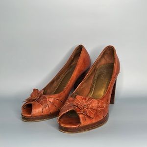 Vintage style Leather Pumps. Handmade leather embellishment. Very well made.